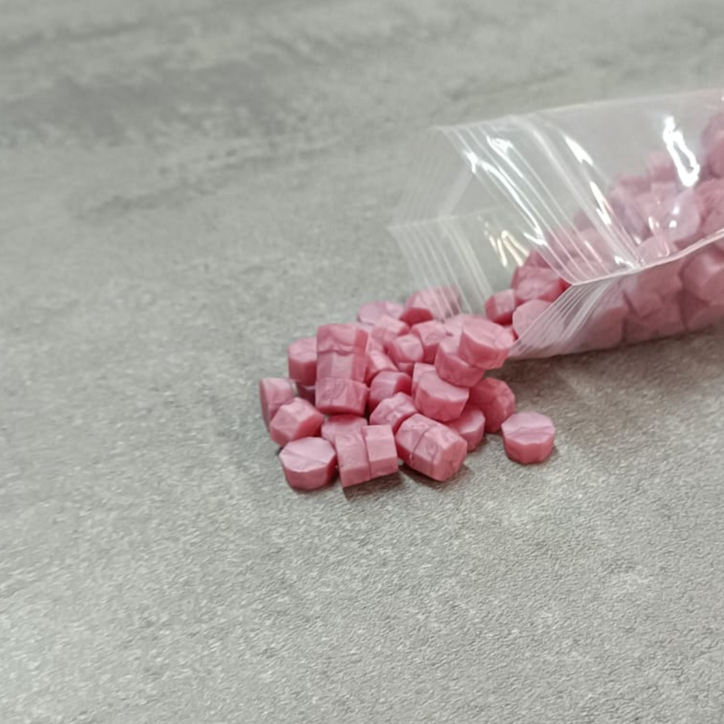 cera-in-grani-rosa-chiaro